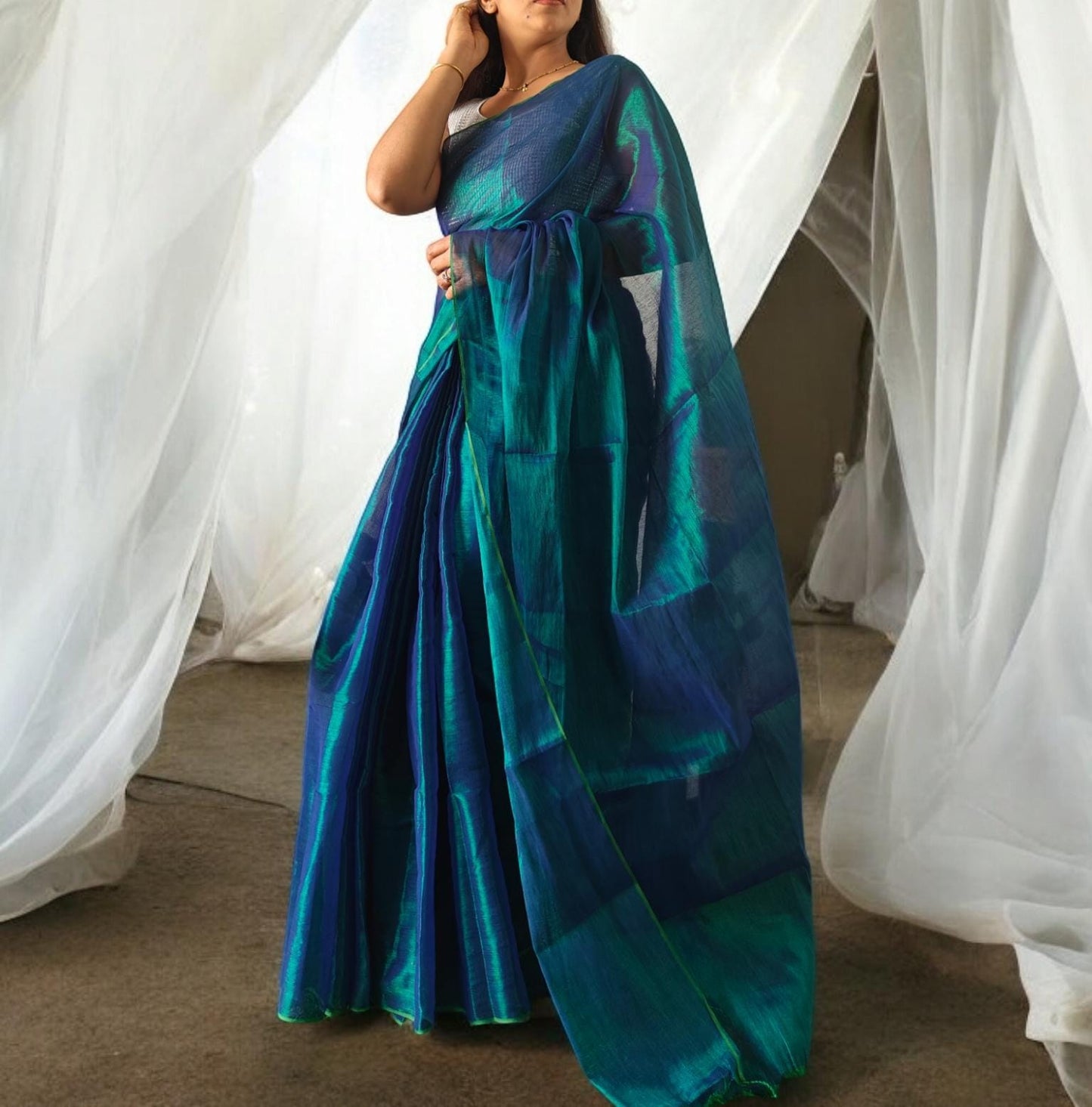 metallic Peacock green Linen saree